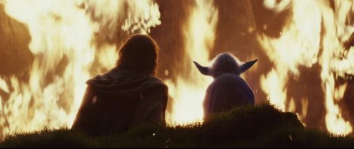 Luke Skywalker and Yoda in front of fire