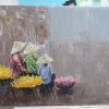 Vietnamese Market Ladies selling flowers under the rain