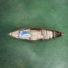 Vietnamese fisher sleeping in a boat