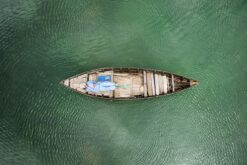 Vietnamese fisher sleeping in a boat