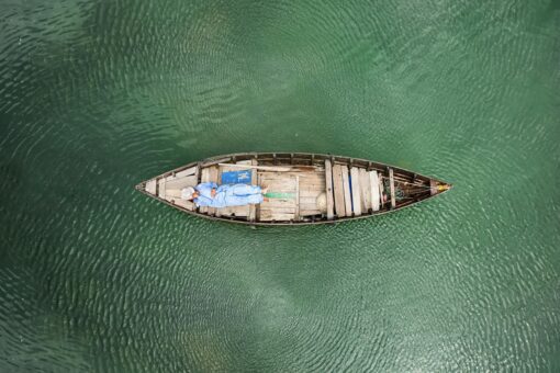Vietnamese fisher sleeping in a boat
