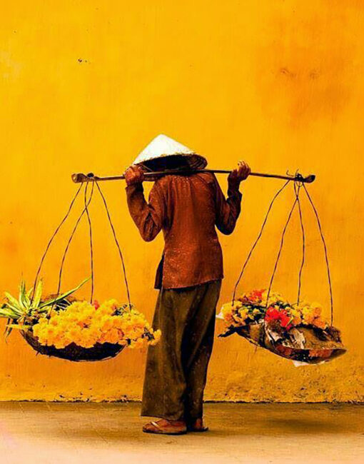 Vietnamese lady selling flowers Hoi An